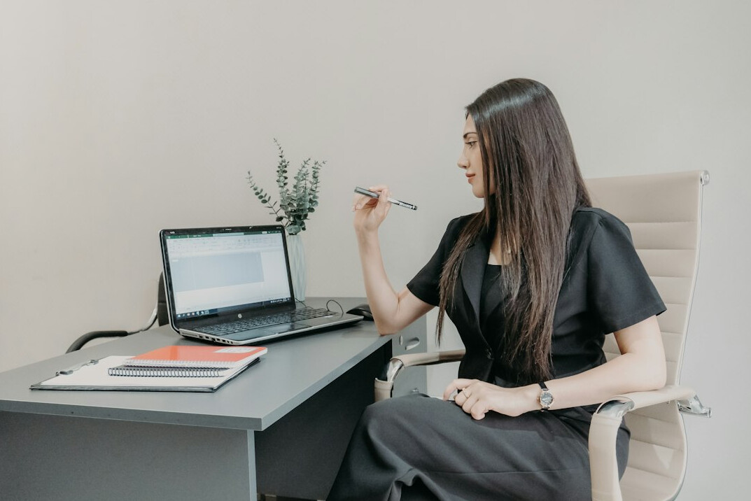 person eating healthy snack at desk