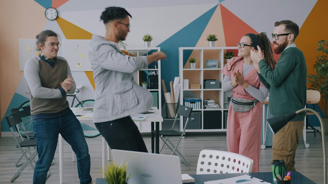 employees stretching in office