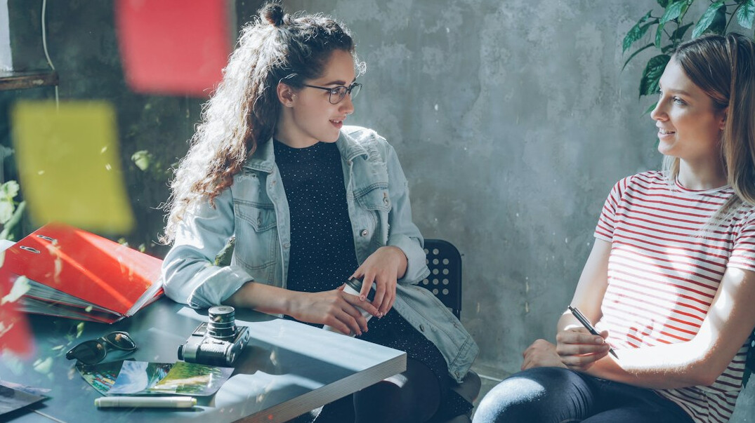 colleagues having supportive conversation